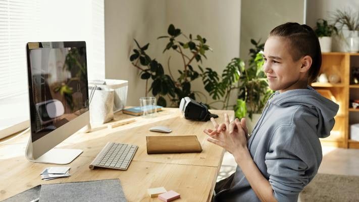 kid sitting in front of a computer
