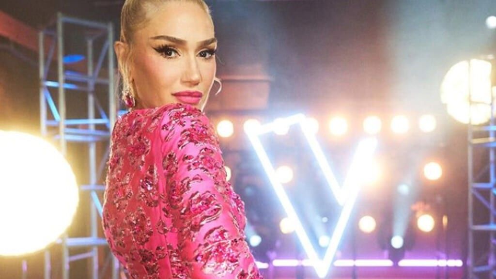 Gwen Stefani wearing a pink dress backstage on the voice