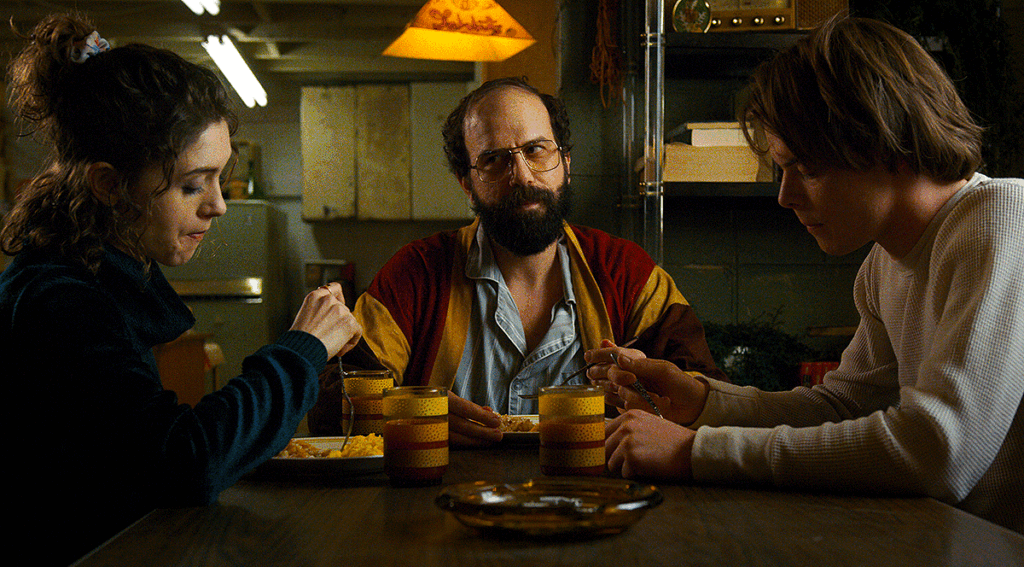 Natalia Dyer as Nancy Wheeler, Brett Gelman as Murray Brauman and Charlie Heaton as Jonathan Byers in Stranger Things