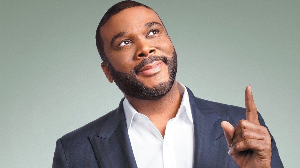 Tyler perry smiling and pointing up 1024x576