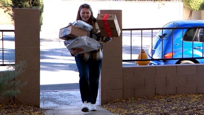 woman carrying lots of gifts