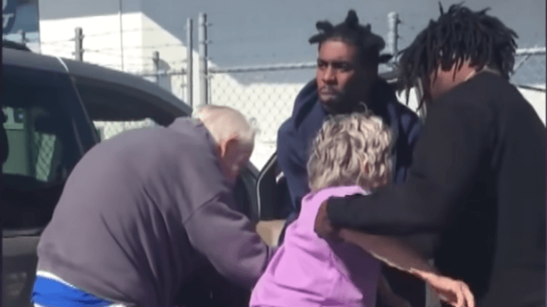 two men in black hoodie