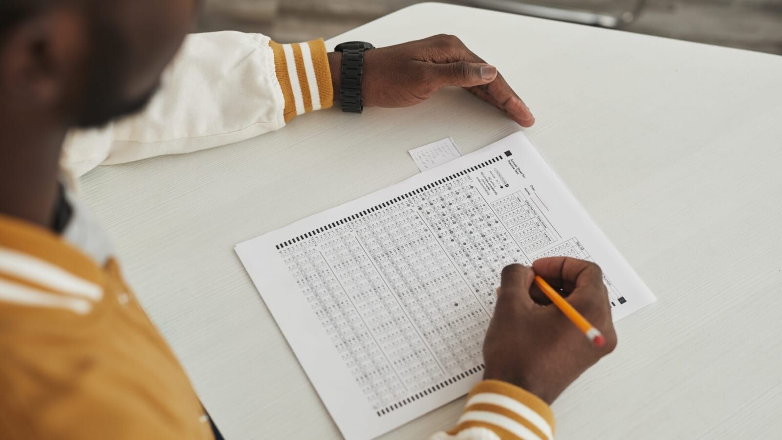 person taking an exam in a classroom