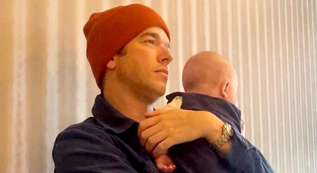 John Mulaney holding son Malcolm.