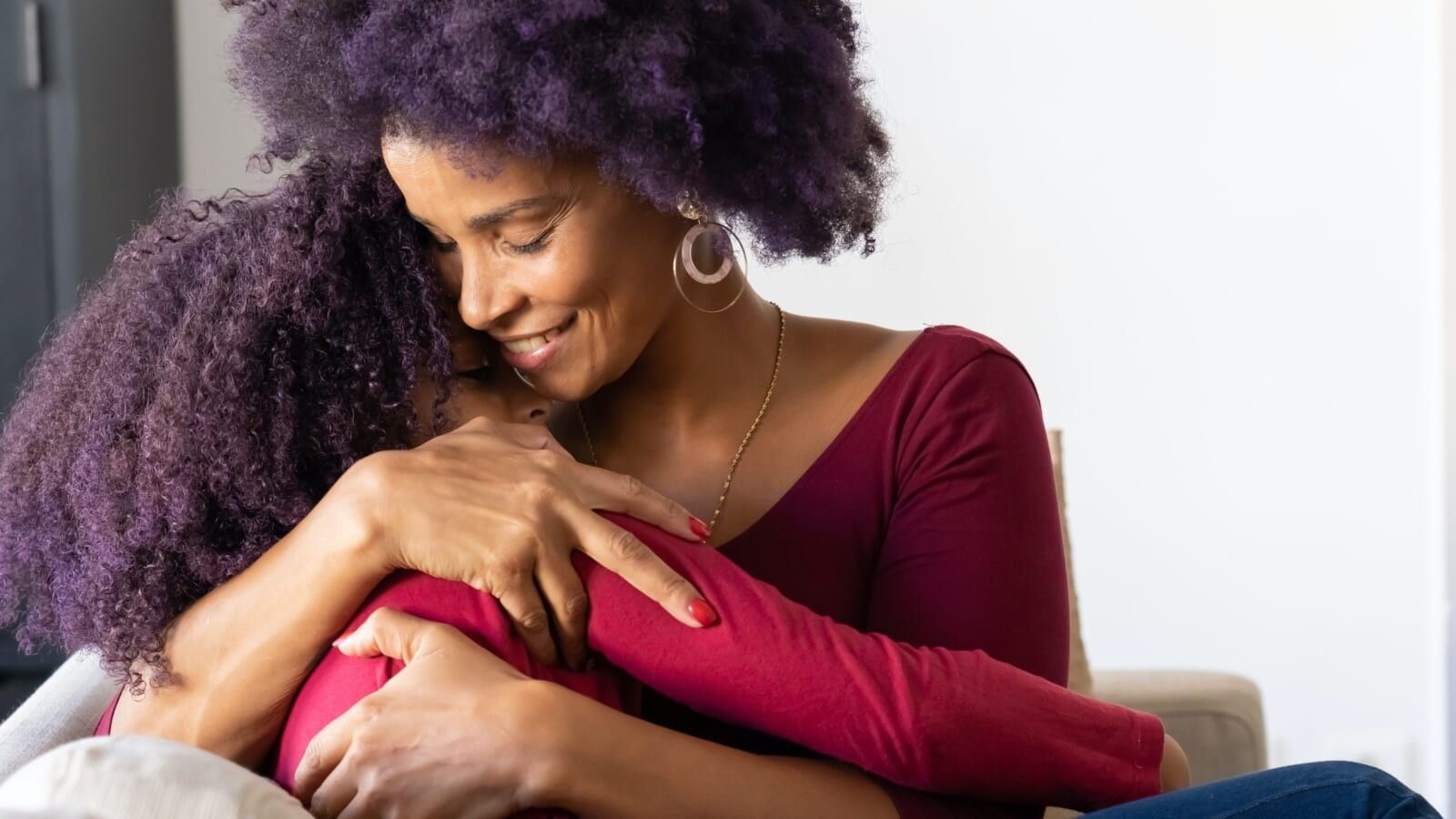 mom hugging her daughter