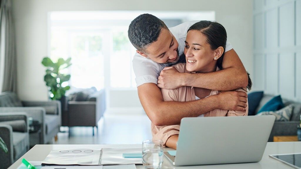 Man hugging woman from behind