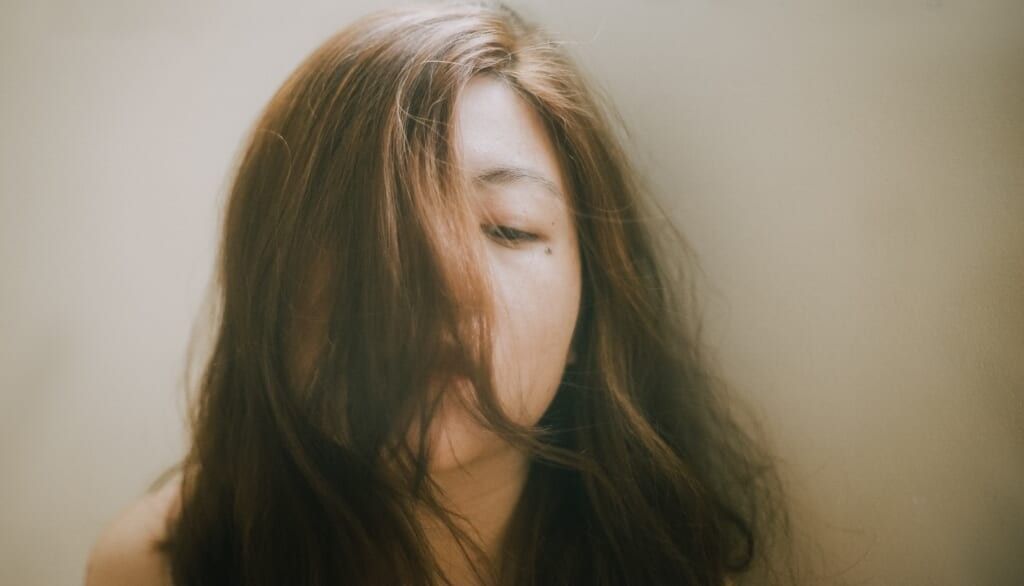 abuse victim hair over face