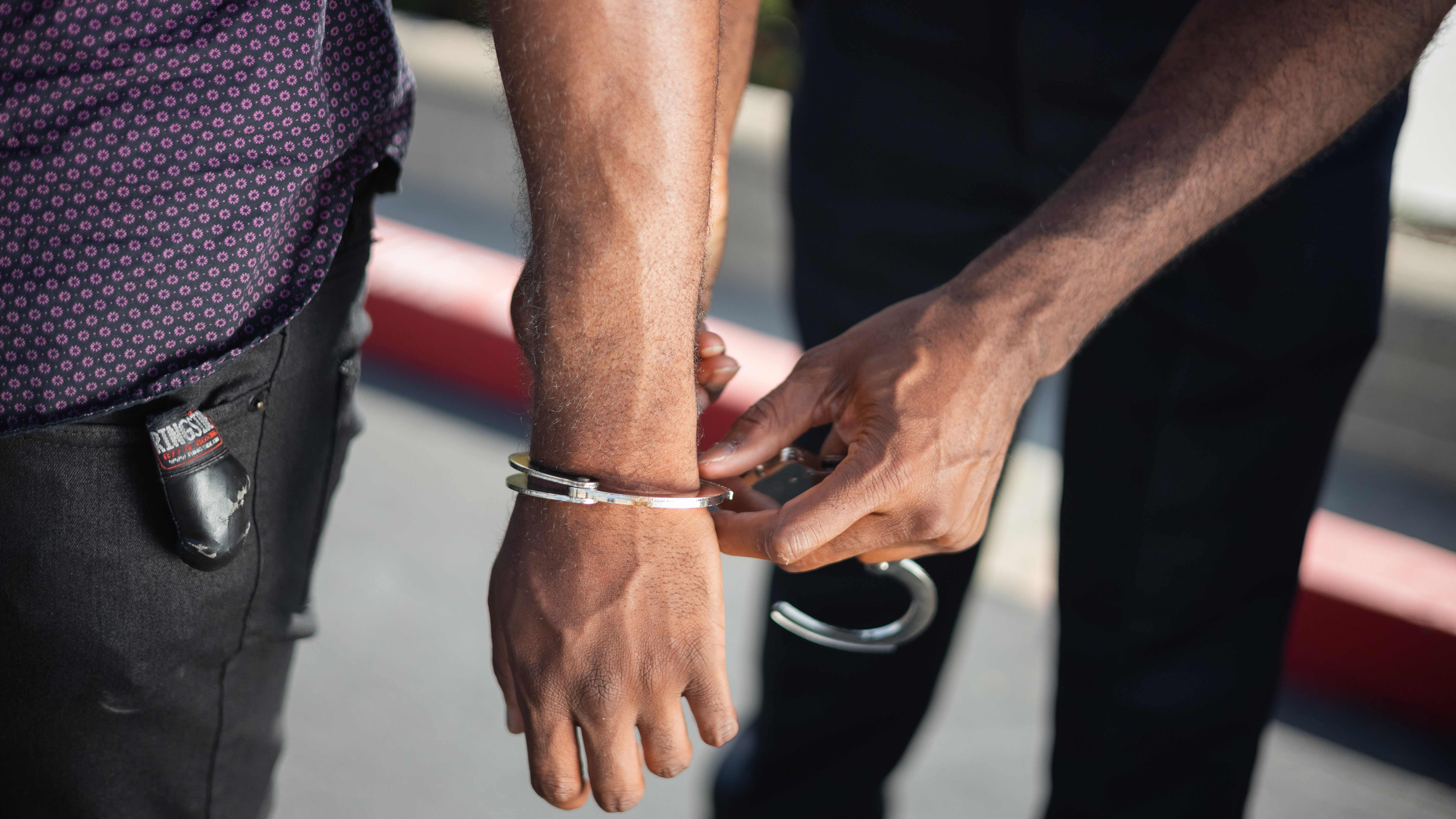 police officer handcuffing a person