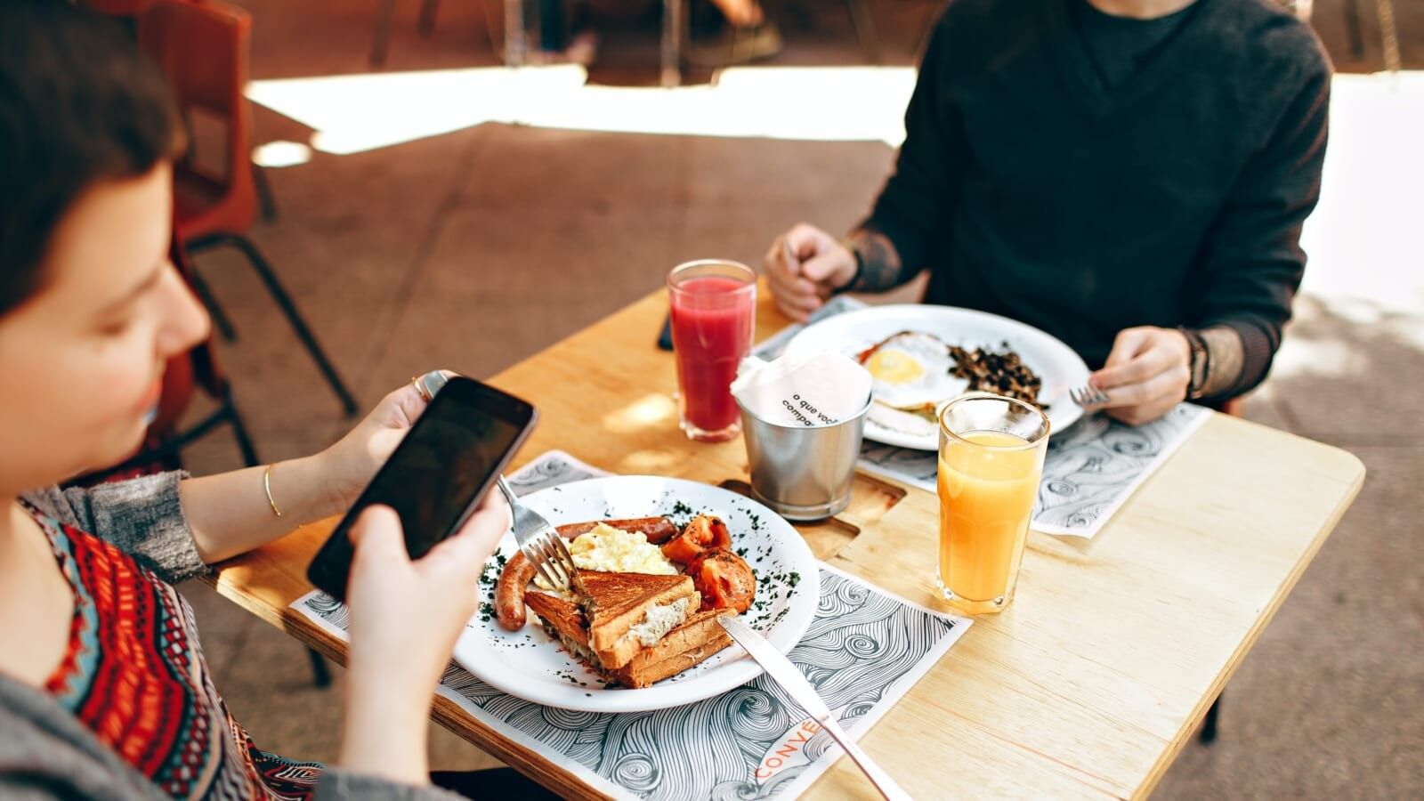 two people eating brunch