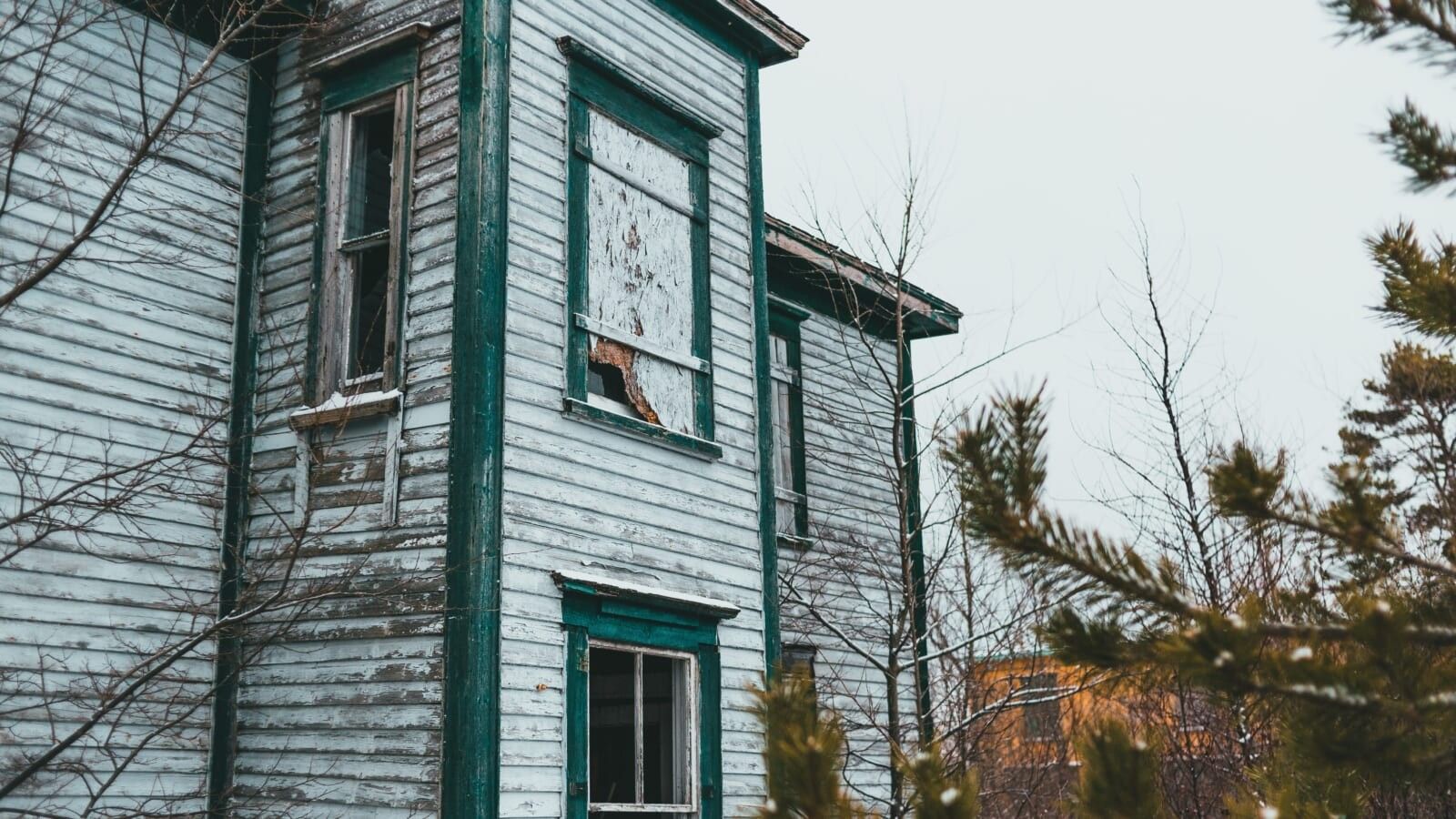 broken down home with shattered windows