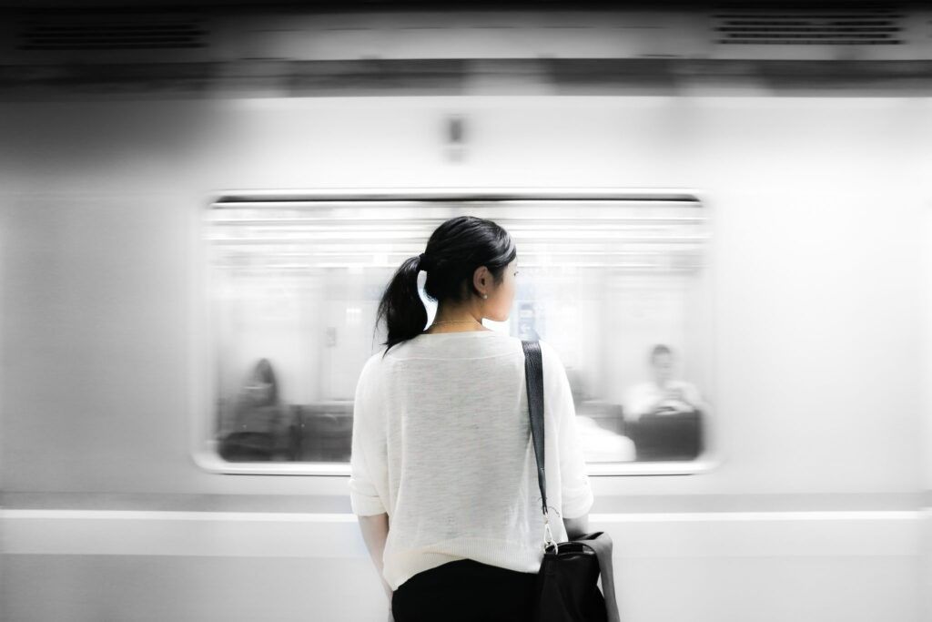 Woman-standing-on-subway-platform