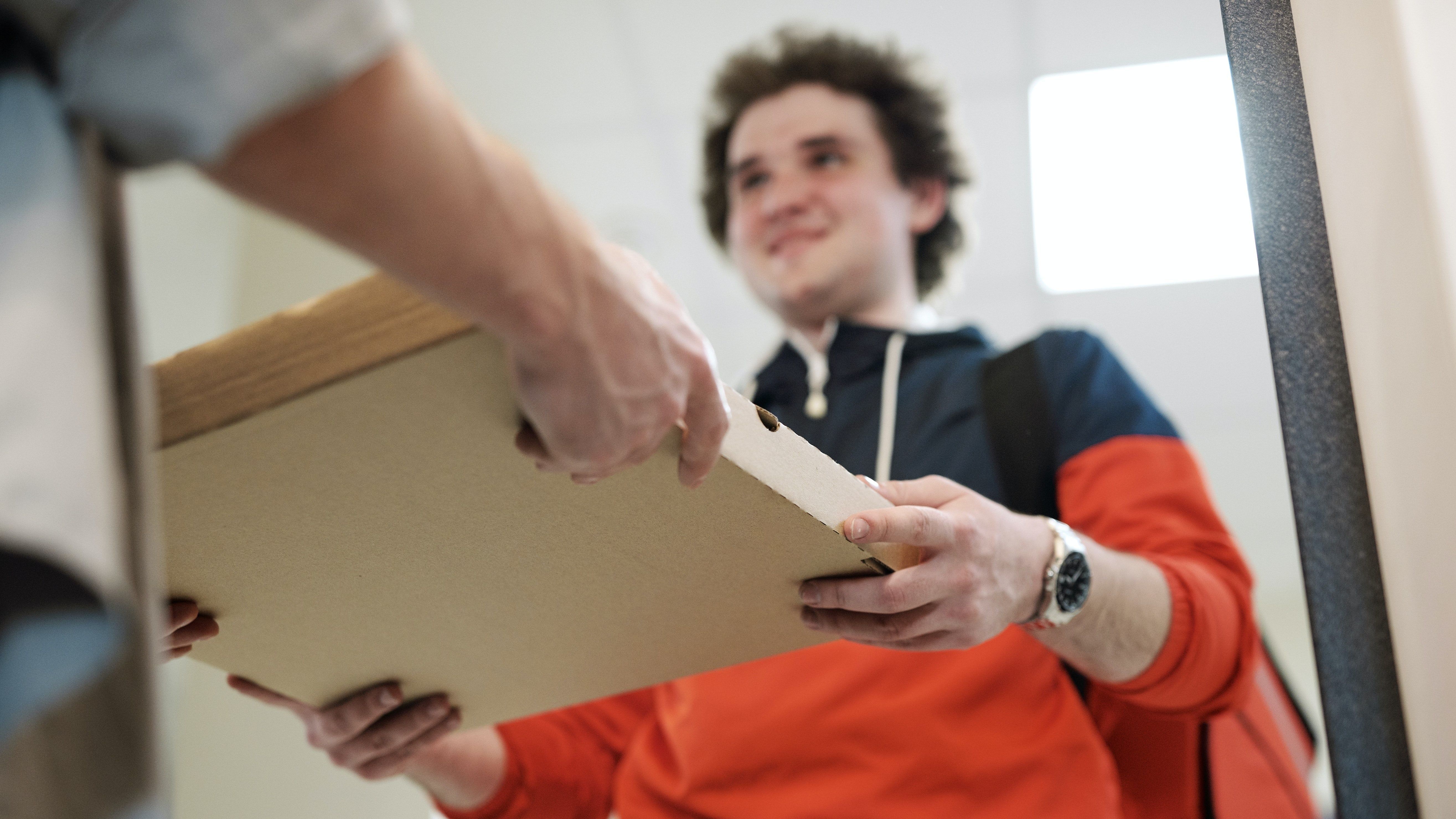 man delivering a pizza