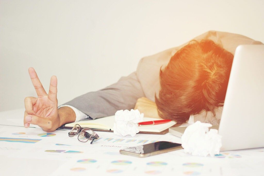 work martyr - workaholic sleeping at work