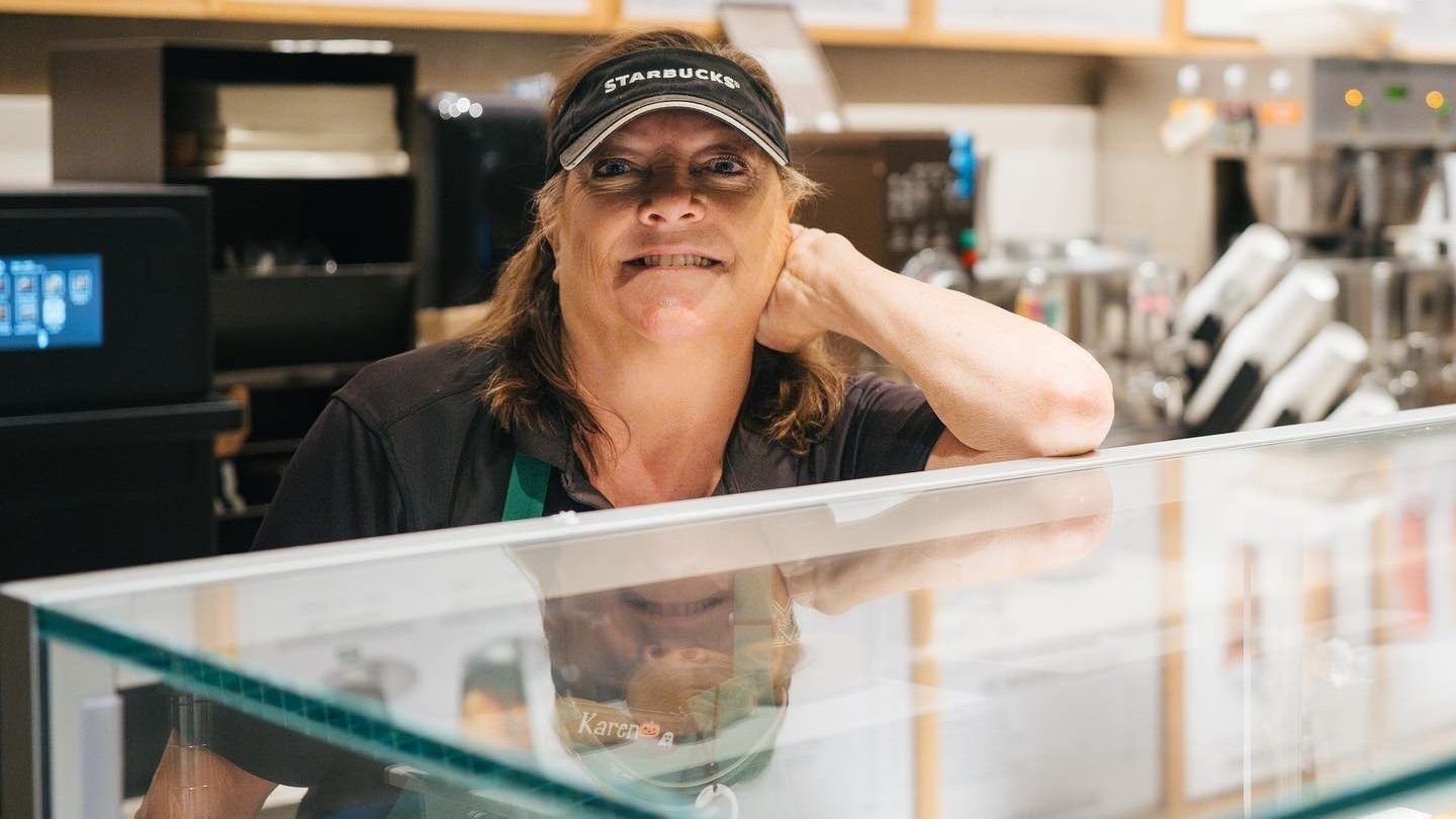 Starbucks employee standing behind the counter