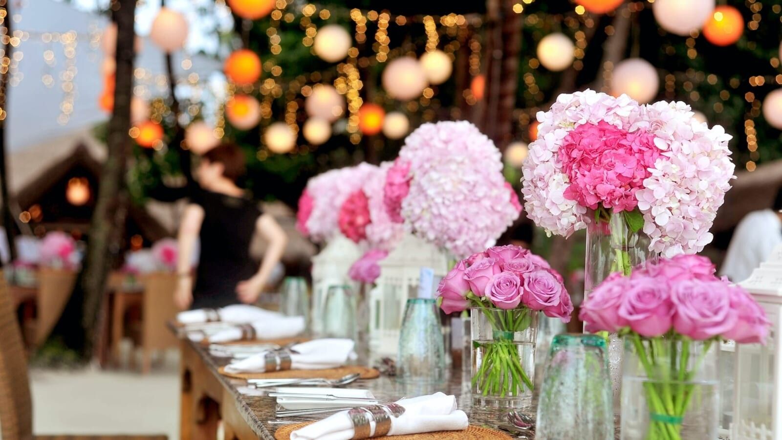 table filled with flowers and cutlery