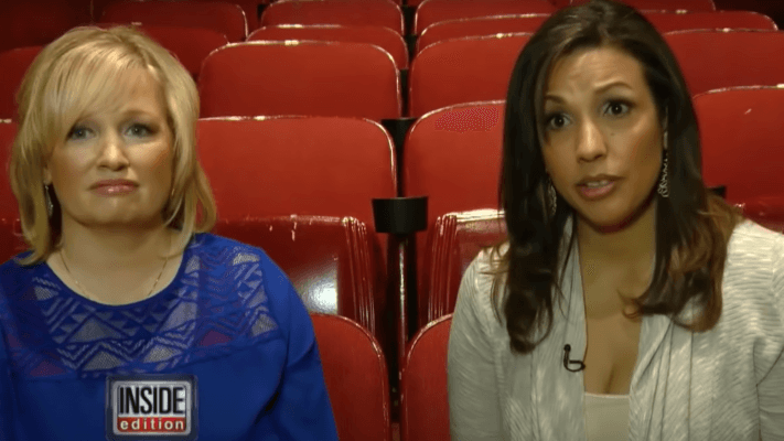 a woman with blond hair and a woman with brown hair sitting in a movie theatre