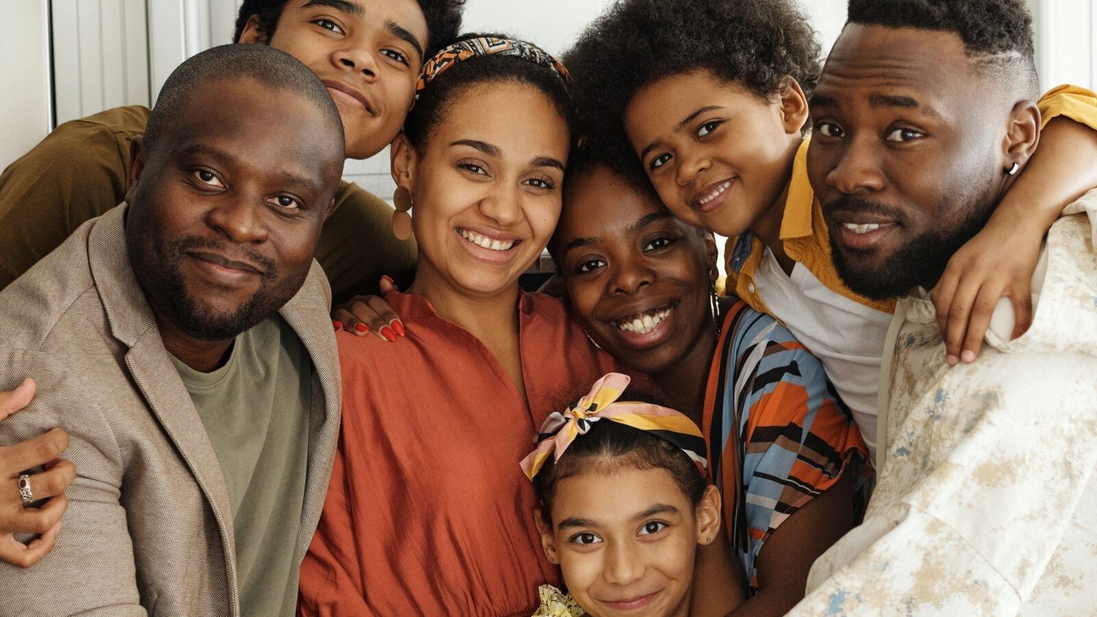 seven people hugging each other