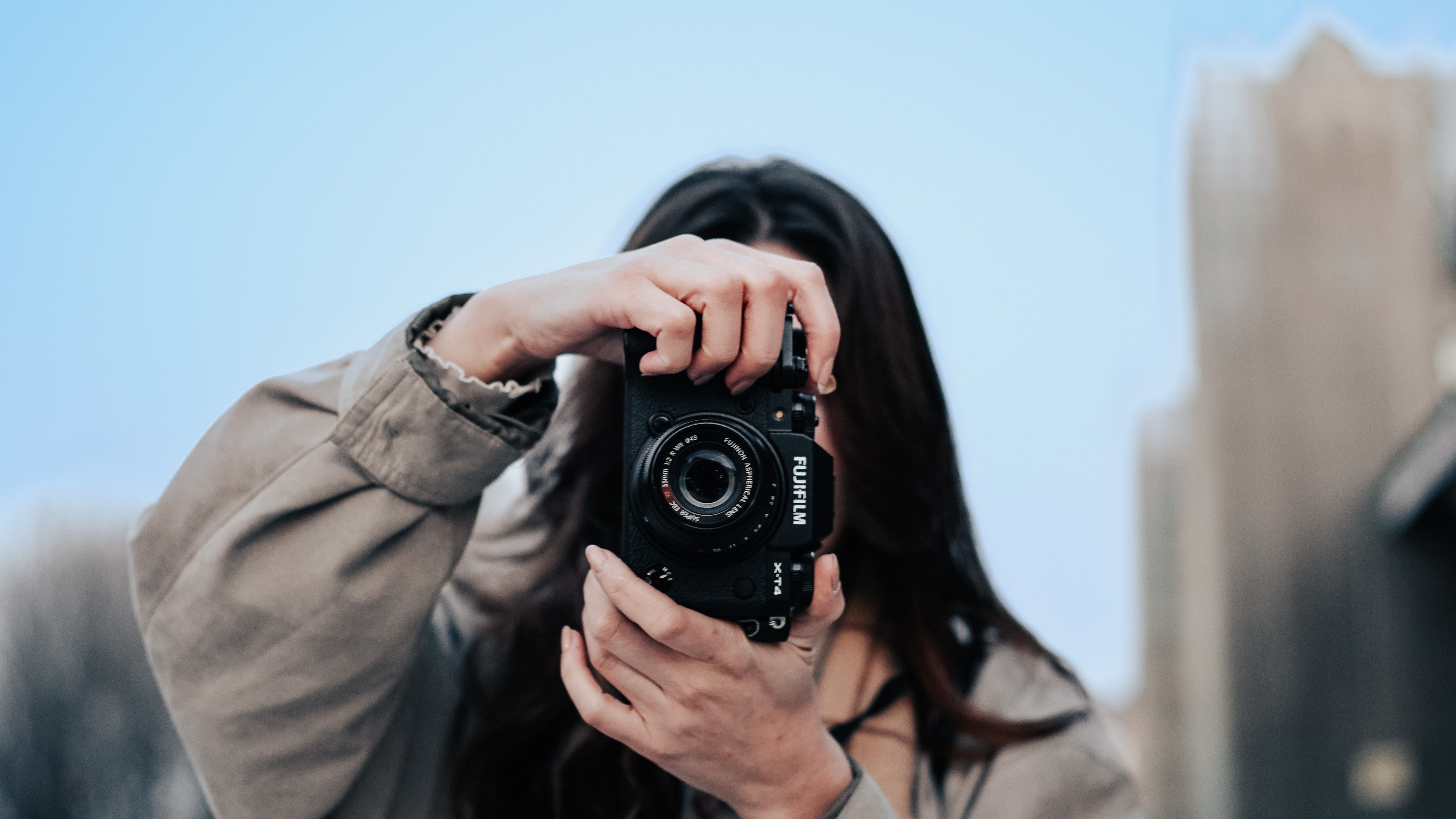 woman taking pictures with her camera