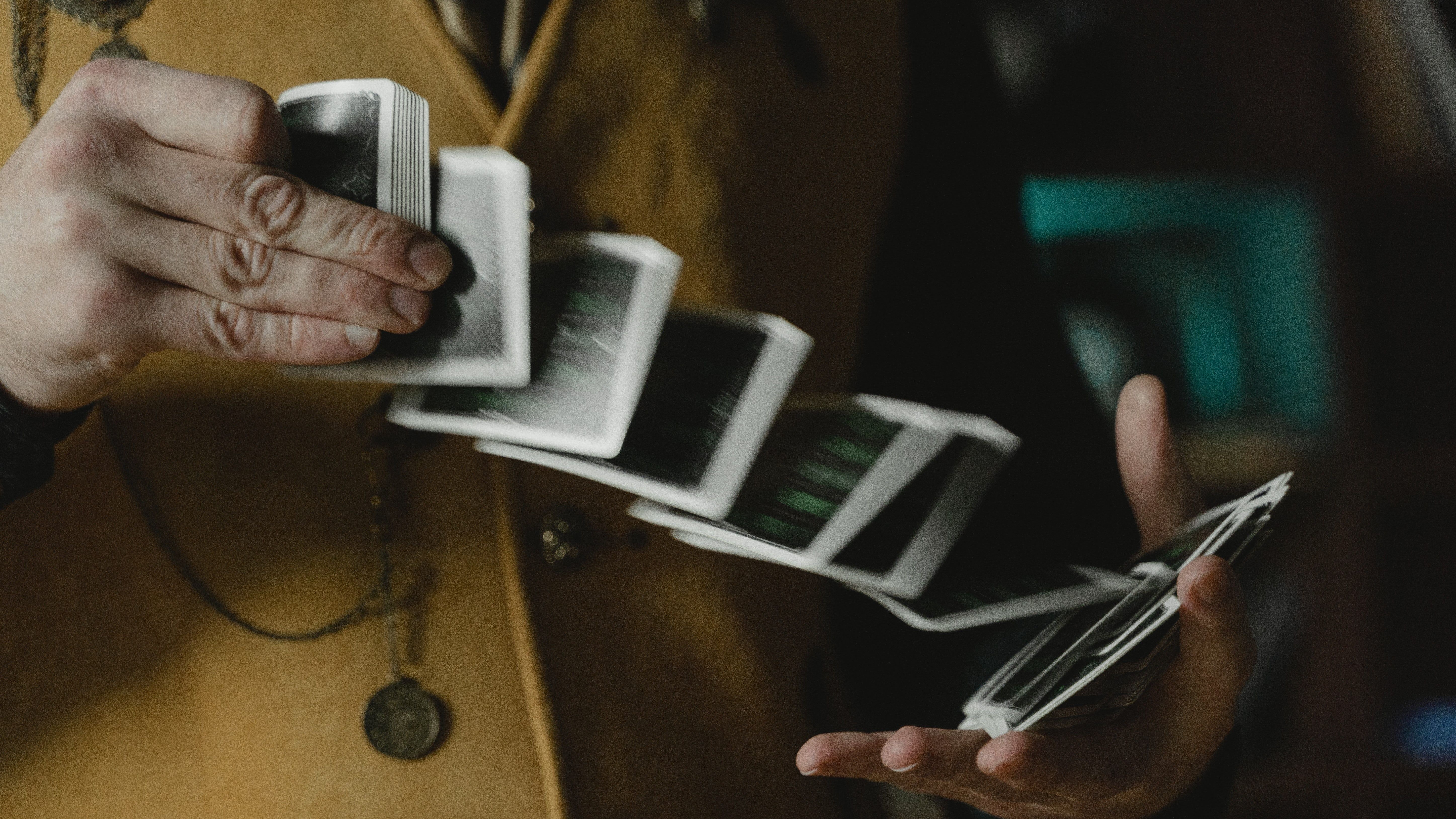 close up shot of a person playing cards