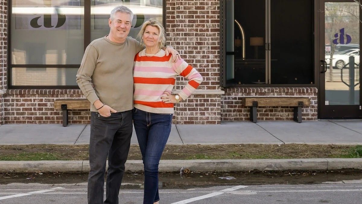 a couple standing on the road