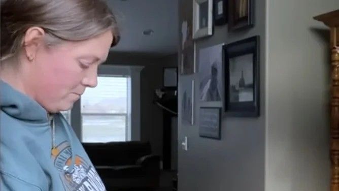 woman wearing a light blue hoodie