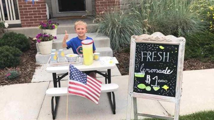 little boy at his lemonade stand