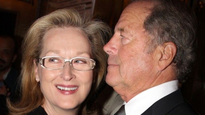 Meryl Streep and husband Don Gummer smiling and hugging.