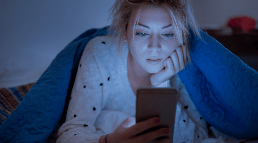 woman looking at phone