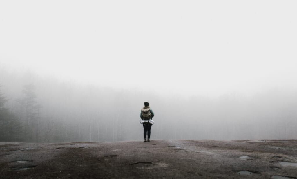 foggy day woman hiking