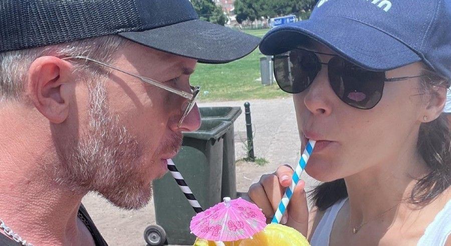 Gal Gadot and husband Jaron Varsano sipping a drink.