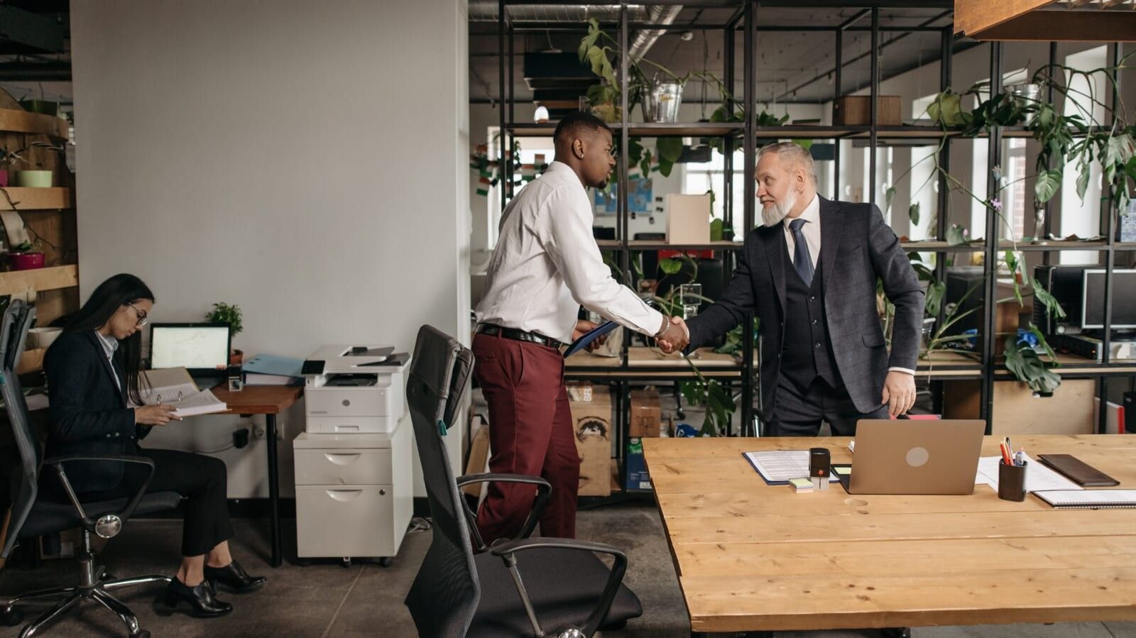 three people working in an office