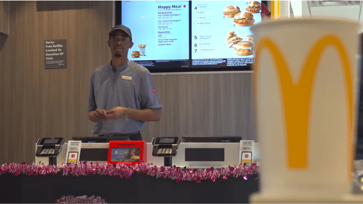 McDonalds employee standing behind counter