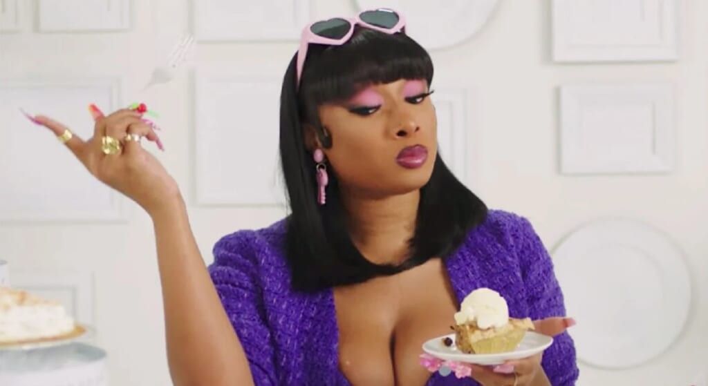 Megan Thee Stallion holding a piece of pie.