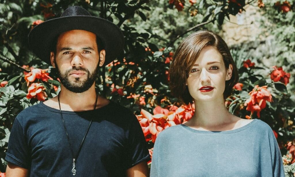 man and woman standing facing the camera