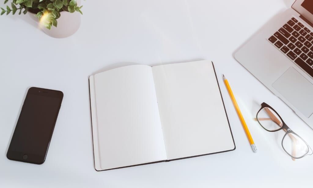 pencil paper and phone