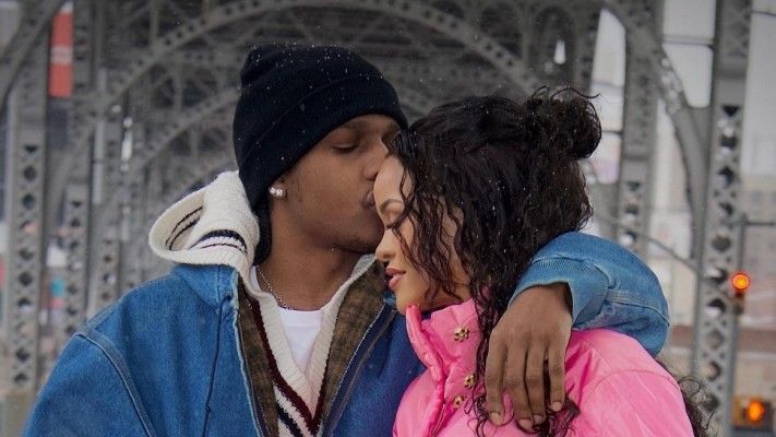 Asap Rocky kissing a pregnant Rihanna.