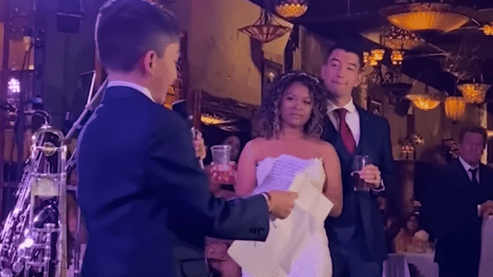 little boy giving speech at wedding