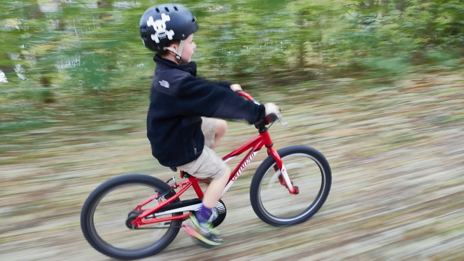 little boy riding a bike