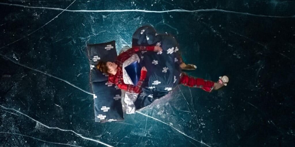 Girl sleeping floating by Egor Vikhrev on Unsplash