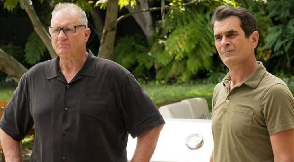 Modern family Jay Pritchett and Phil Dunphy look at camera