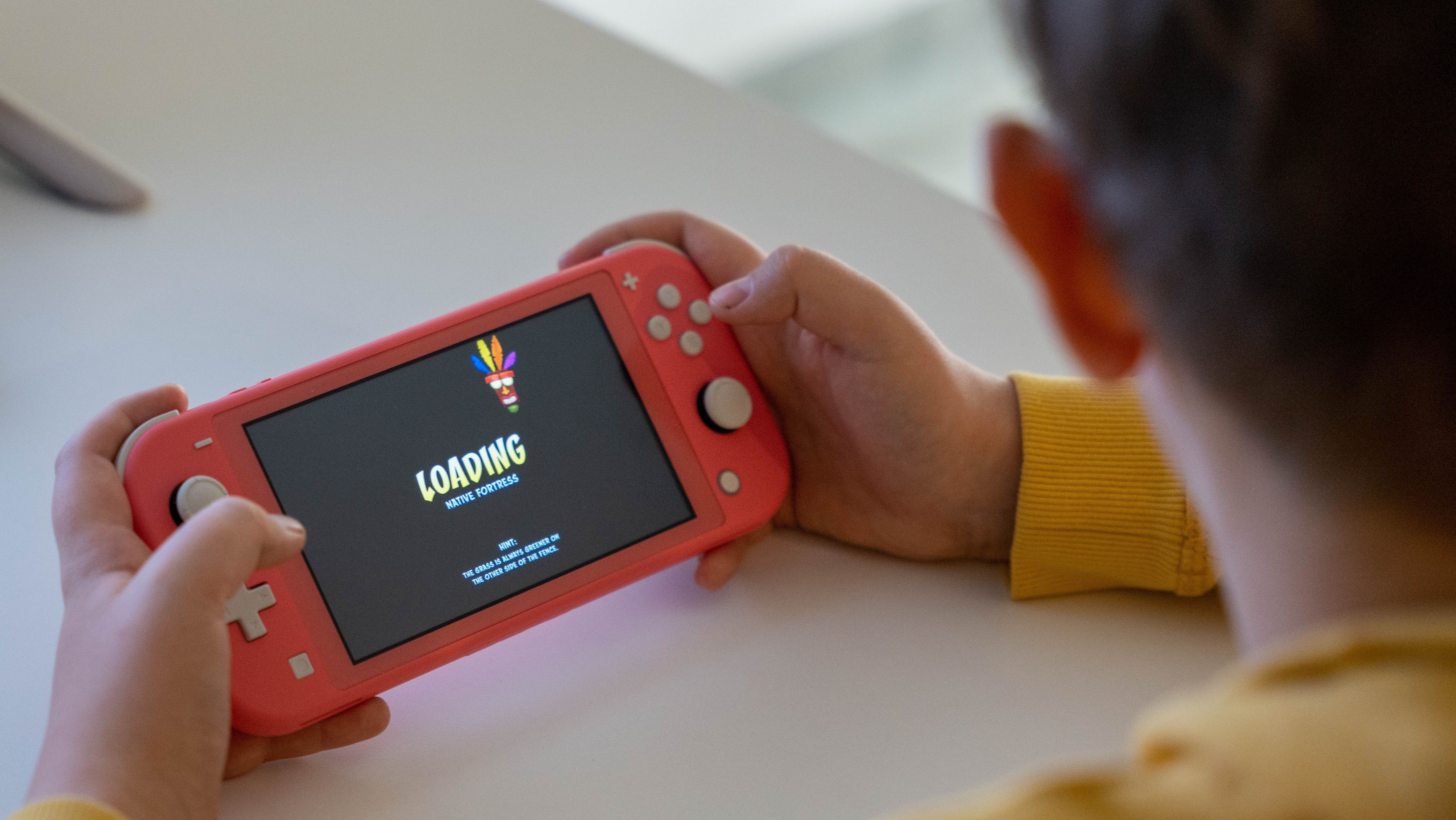 boy playing with a nintendo