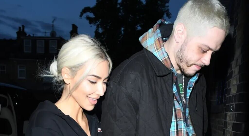 Kim Kardashian dressed in black heading into a club with comedian Pete Davidson.
