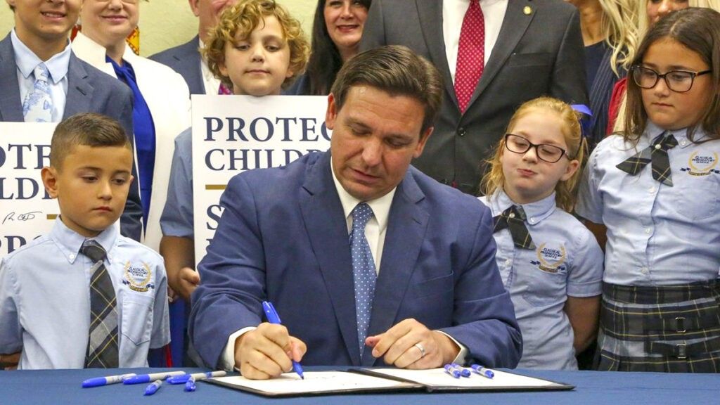 Florida Governor Ron DeSantis signs in Don