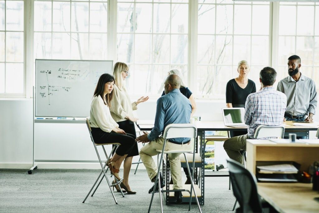 Engineers and designers in team meeting in design office conference room