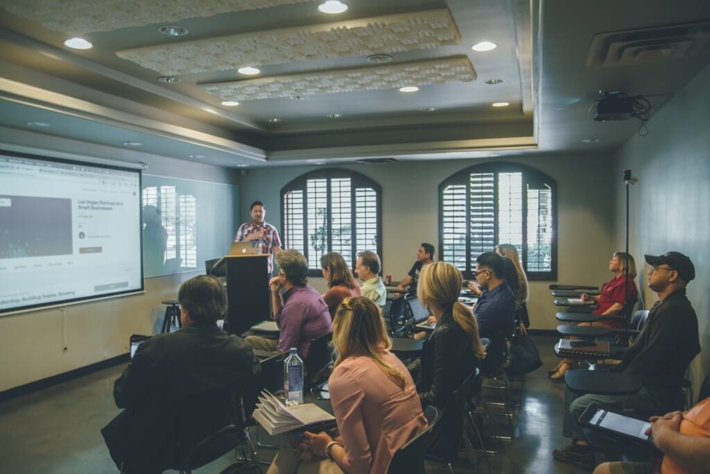 teacher and students in university classroom