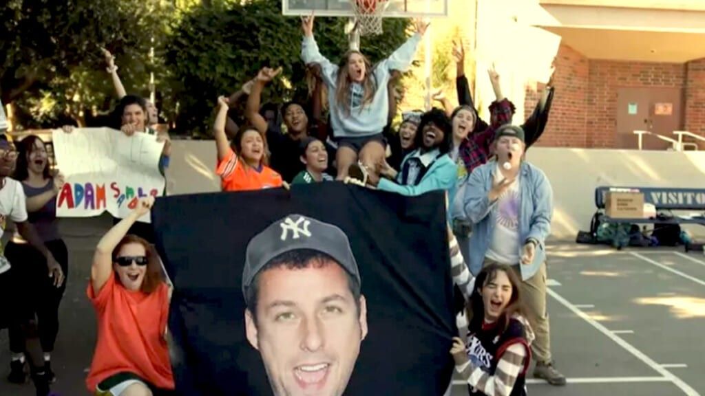 Charloette Jolley poses with friends while getting Adam Sandler