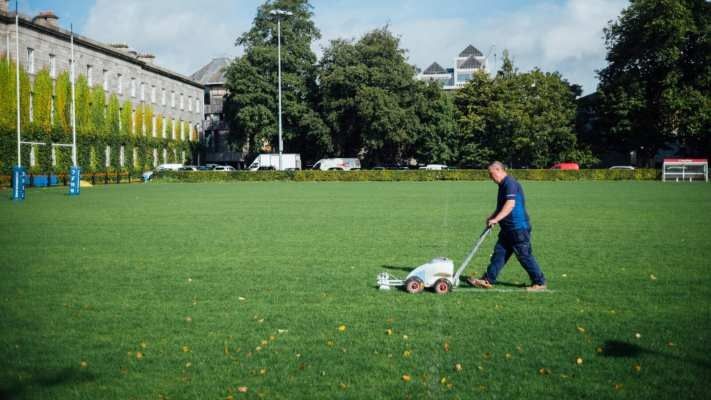 man mowing a lawn
